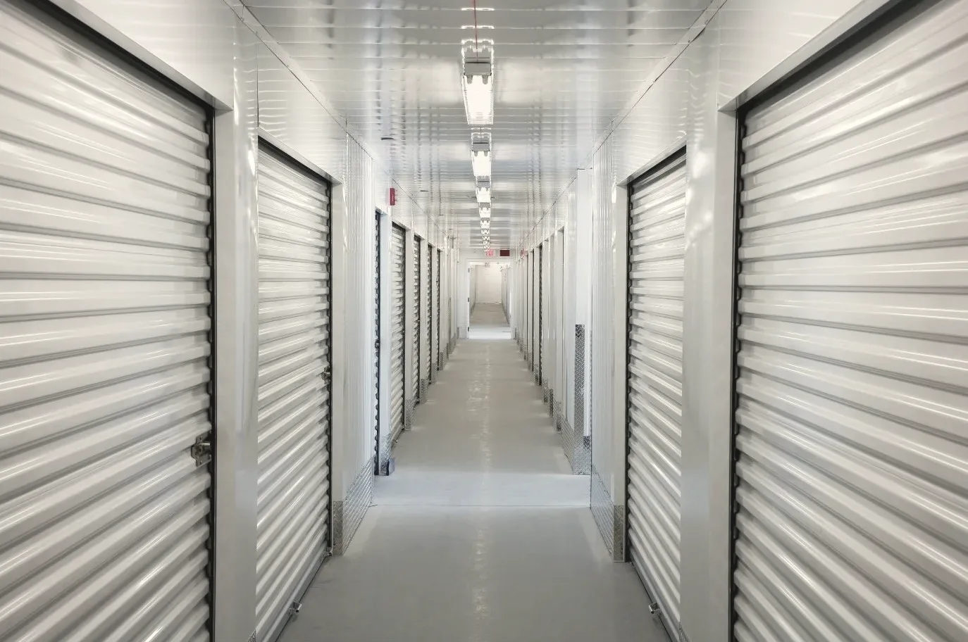 Corridor of closed self-storage unit roller doors